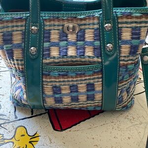 Patrica Nash never used has 2 sides with zipper compartment Teal straw bag